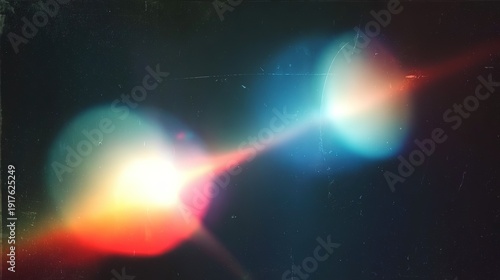 Colorful light leaks and grunge film backdrop. Retro film overlay with scratches, dust, light rays, grain and noise texture. Lens flare and film burn effects on black background.