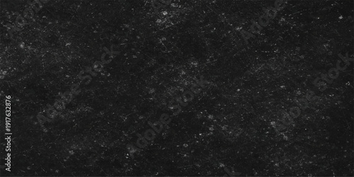 Abstract texture of falling snowflakes against a dark black night sky background creates a shimmering stars and galaxy pattern for a festive Christmas wallpaper