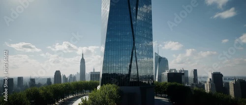 Ultrawide 4K Drone Orbit Around Tall Glass Skyscraper with Urban City Skyline