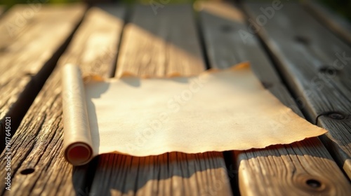 Wallpaper Mural Aged Parchment Scroll Unfurling on Rustic Wooden Surface, Basking in Golden Sunlight Torontodigital.ca