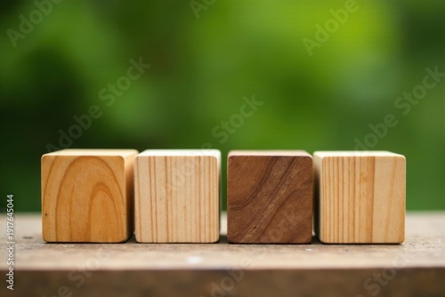 Wallpaper Mural Four Wooden Cubes Arranged in a Row Against a Soft Green Background Torontodigital.ca