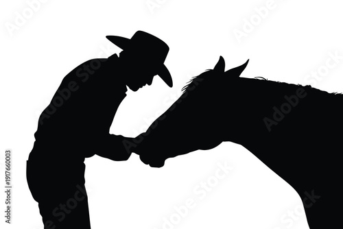 A silhouette of a cowboy gently touching the face of a horse