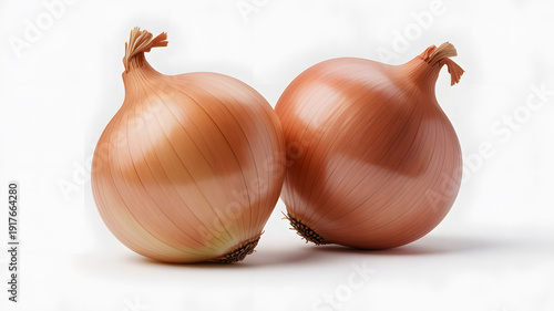 Two brown onions sitting side by side on a white surface