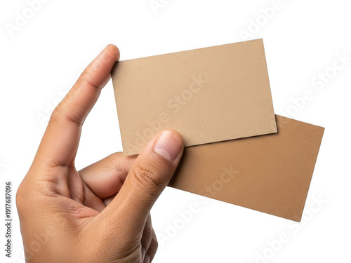 Brown cardboard business cards being held by a hand isolated on transparent background