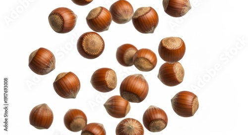 Wallpaper Mural Close-up of multiple hazelnuts scattered against a white background Torontodigital.ca