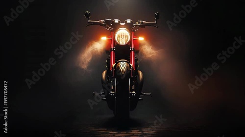 Motorcycle front view with headlights illuminated in dark setting  