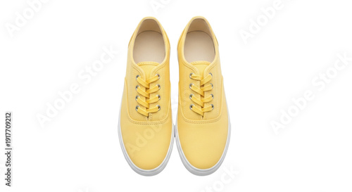Isolated yellow canvas shoes footwear, casual comfortable laced, sneakers for everyday wear