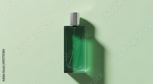 Green perfume bottle on a light green background with shadow