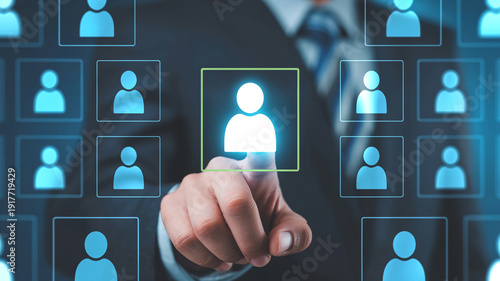 Businessman hand touching virtual screen with human icon choosing employee or talent for company, recruitment concept