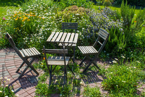 Wallpaper Mural herb spiral in the garden with fresh herbs and flowers Torontodigital.ca
