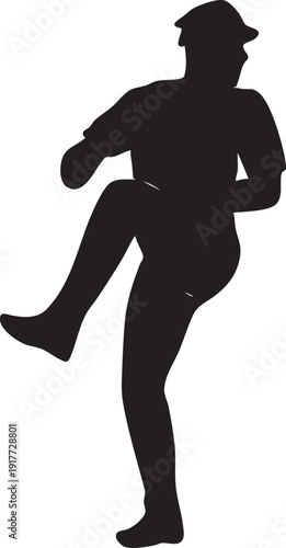 Silhouette of a man kicking his leg up high in a dynamic pose