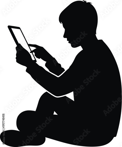 Silhouette of person sitting on floor and using digital tablet for browsing and mobile work