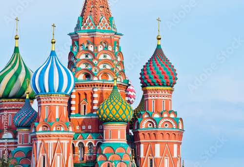 Domes of the Cathedral of Vasily the Blessed (Saint Basil's Cathedral) against blue sky. Close-up. Early evening. Red square. Moscow. Russia