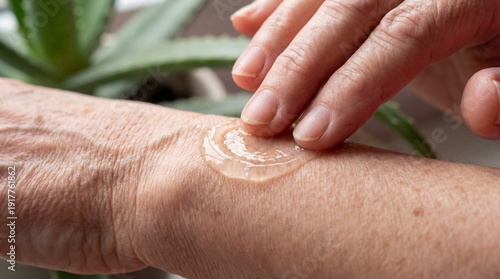 Close-up of a hand applying...