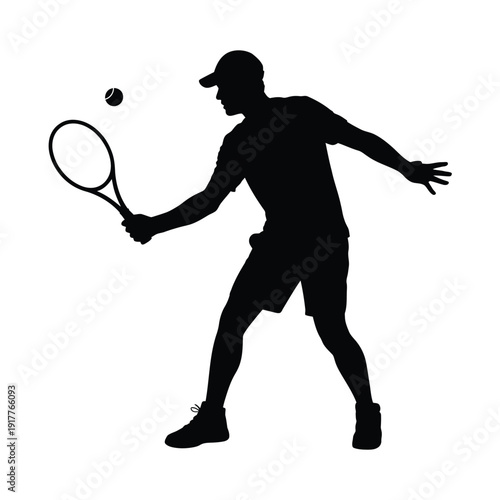Silhouette of a tennis player in action preparing to hit a ball