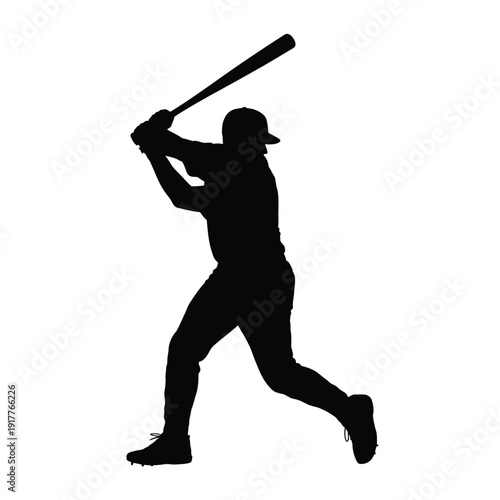A silhouetted baseball player prepares to swing a bat during a game