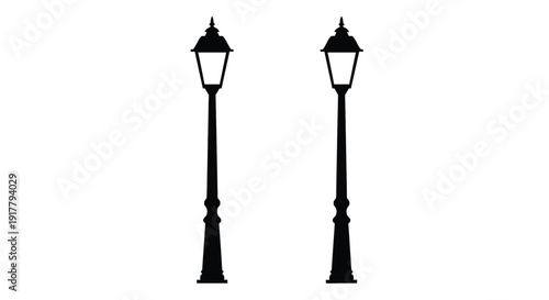 Two vintage street lamps stand against a bright background silhouette