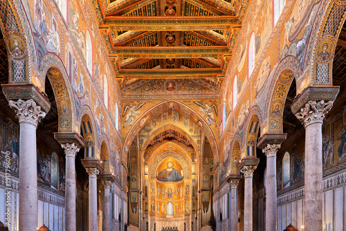 A view through the monumental nave of Monreale Cathedral towards the enthroned Christ Pantocrator
