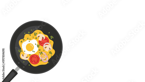 Healthy omelet cooking in a black frying pan topped with fresh tomatoes, mushrooms, sliced onions, and green herbs on a white background.