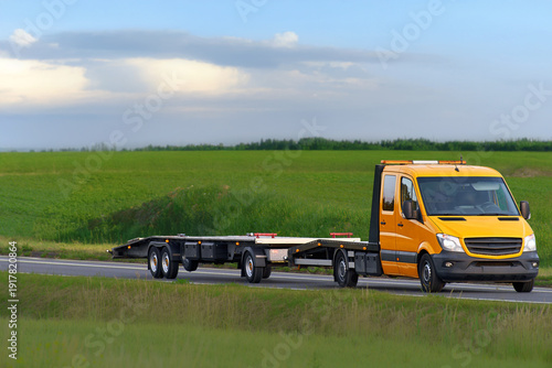 Wallpaper Mural 24-hour towing service vehicle on a country road Torontodigital.ca