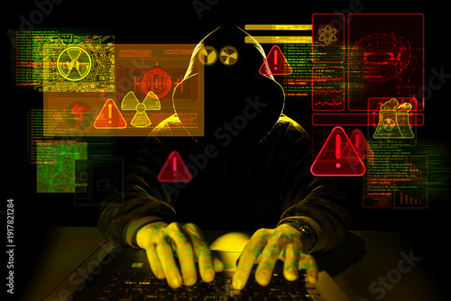 Foto Hooded cyber threat targeting nuclear energy infrastructure