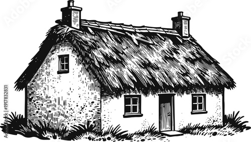 Traditional thatched cottage with stone walls and chimney smoke in countryside rural setting