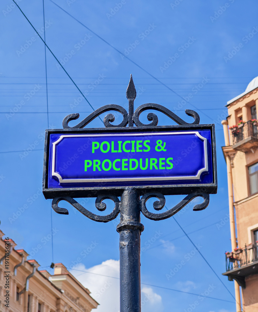 Fototapeta premium Policies and procedures symbol. Concept words Policies and procedures on beautiful big blue road sign. Beautiful blue sky and buildings background. Business policies procedures concept. Copy space