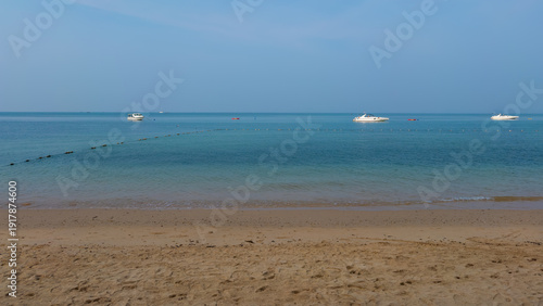 Boats moored in the sea on a beautiful morning on the beach