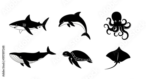 Collection of Black Silhouette Icons Featuring Sea Creatures Whale Shark Dolphin Octopus Turtle and Manta Ray.