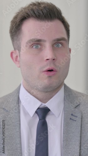 Portrait of Young Businessman shocked by Failure