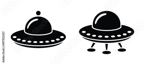 Two black silhouette of flying saucers or UFOs on a white background