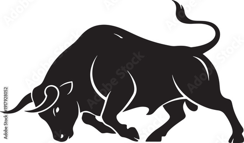 Black bull charging forward with head down and tail up