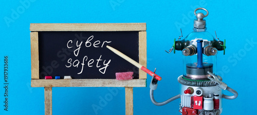 Glass robot teacher pointing at chalkboard with Cyber safety inscription. Digital security lesson, school presentation design