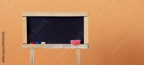 Toy wooden black chalkboard, empty space for text.