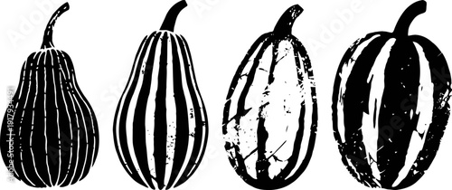 Four assorted decorative pumpkins with vertical stripes, autumn harvest and halloween symbols