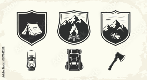 A collection of camping-themed icons, featuring shields with mountains, a tent, fire, and gear
