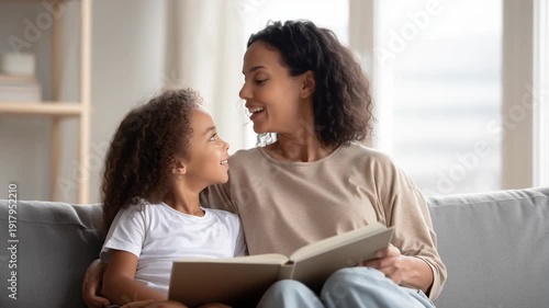 Multiracial Mother and Daughter Reading Together on Modern Sofa – Authentic Mother’s Day Family Lifestyle Video