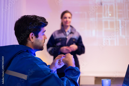 audiance Meeting training, presentation and Project. Hispanic latin male engineer working and learning at meeting. Engineers Heavy Industry Employees Discussing Mechanism for Industry Equipment.
