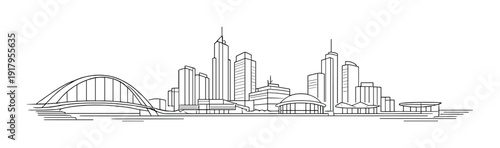 Waterfront skyline with arch bridge and high rise towers by river