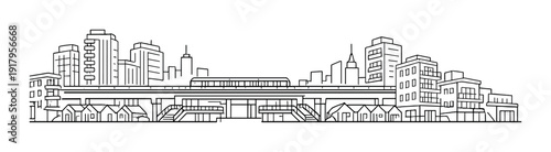 Elevated train traveling on viaduct across city skyline