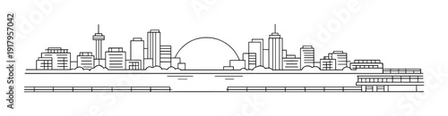 Riverside city skyline across water with low sun arc