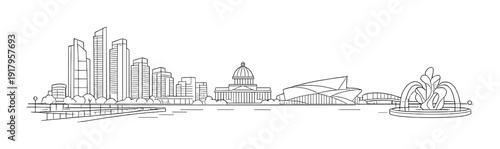 City skyline along waterfront with dome and fountain