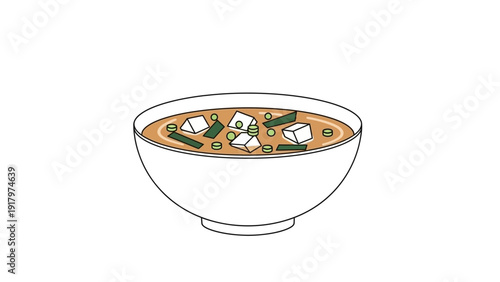 A bowl of delicious miso soup with tofu and seaweed.