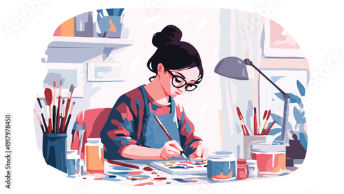 Person wearing glasses and an apron creating art with paints and brushes