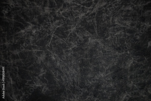 Dark black acid wash denim fabric texture background for design.