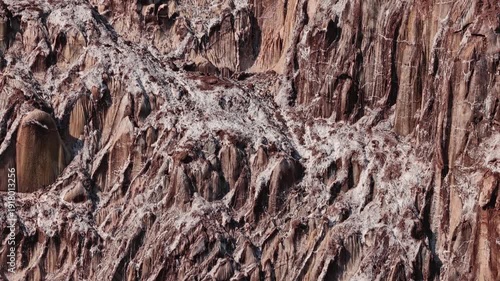 Colorful salt mountains on Hormuz Island in Iran, known as the Rainbow Island, featuring surreal mineral Martian landscape and vivid natural patterns in Persian Gulf. Unique geological formations and 