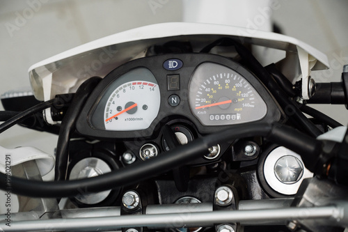 Tableau sur toile Motorcycle dashboard: speedometer and odometer in detail.