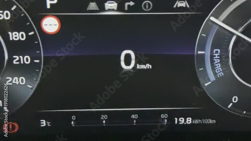 digital dashboard of electric car with range and driven mileage