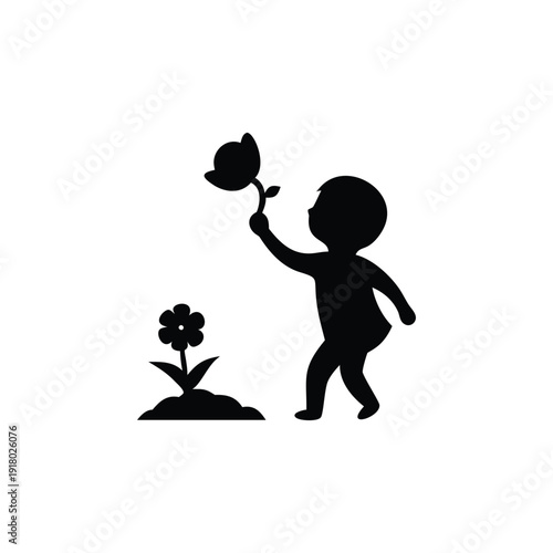 Child holding teddy bear silhouette beside flower
