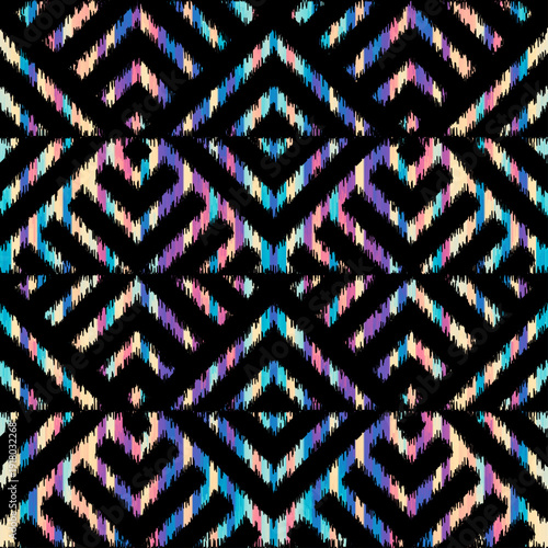 Seamless ikat pattern. Ethnic ikat colorful repeating pattern on black background. Ornamental tribal fabric and textile swatch print design. Vector